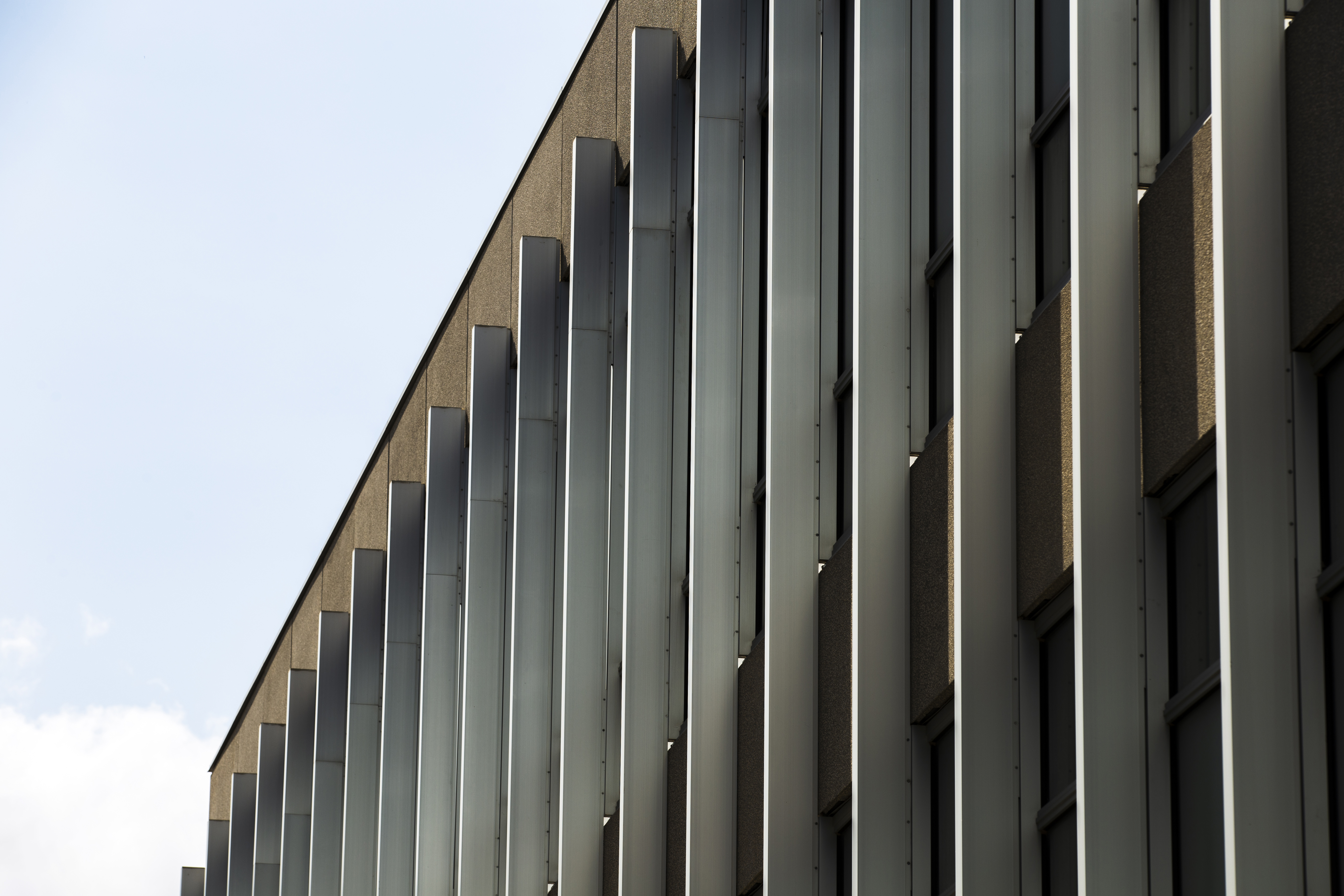 Metal facade systems comparison showing durability of steel and aluminum solutions