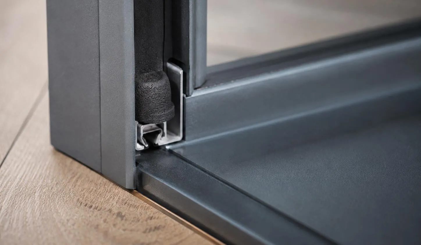Close-up of intumescent fire and smoke seal in a steel door frame
