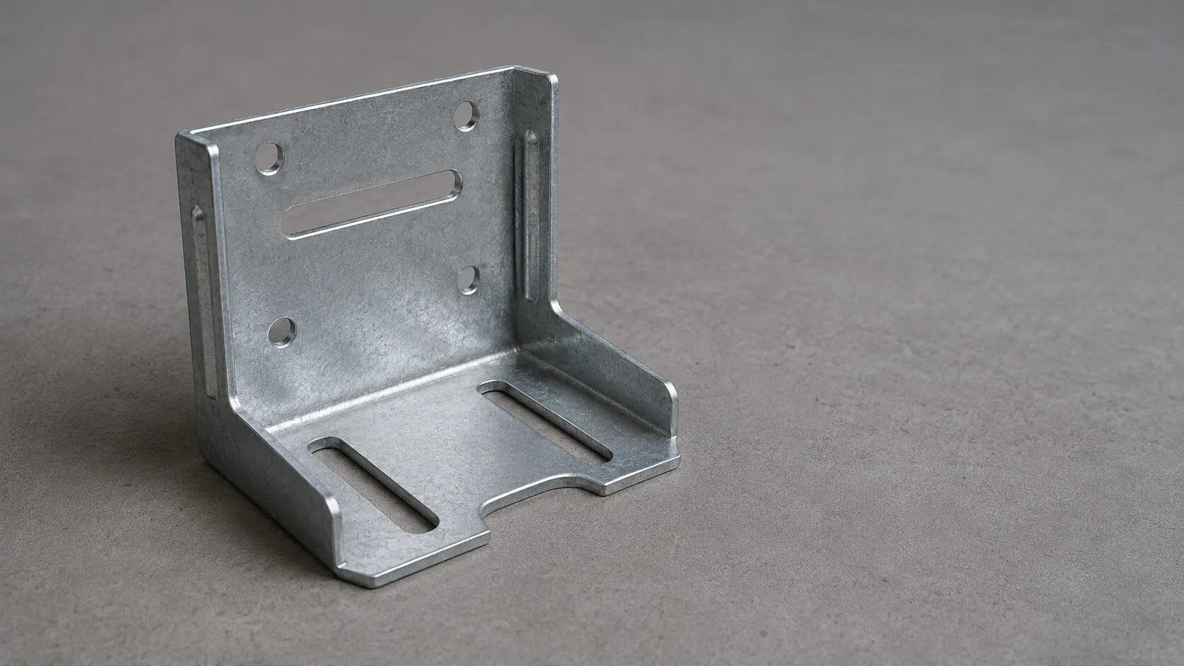 Cold formed steel bracket for elevator guide rails with adjustment slots